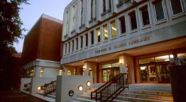 Alden Library building exterior at dusk.