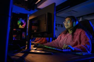 An OHIO student  plays esports in the OHIO Esports Arena