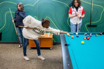 OHIO students play pool in the Bobcat HangOUt