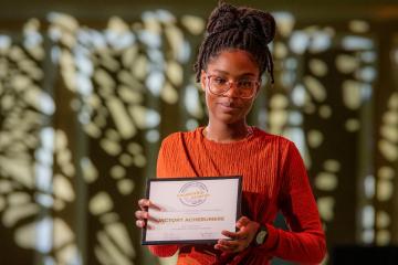 Victory Achebumere is shown with her award at the Leadership Awards