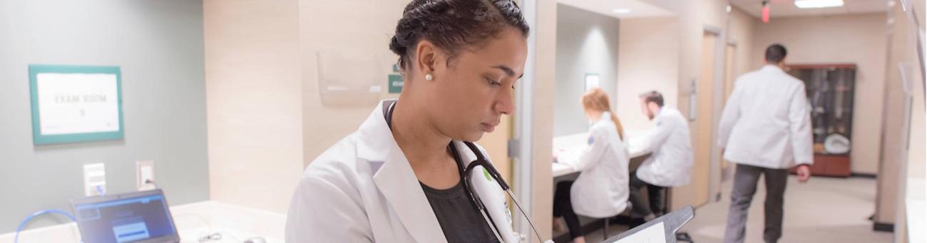 HCOM student at the Dublin campus going over charts